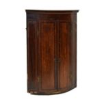 Georgian inlaid bowfront corner cupboard with two hinged doors, 103cm high Condition: Losses to