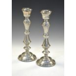 Pair of Elizabeth II silver candlesticks, Birmingham 1965, (filled), 27cm high Condition: Slight