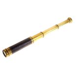 Small three-draw brass and leather bound telescope, marked J. Peacock 68 Strand, London Condition: