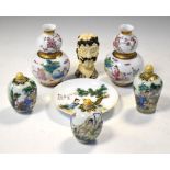 Group of modern Chinese porcelain decorated with erotic scenes, together with a cast resin erotic