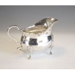 Edward VII silver sauce boat standing on four scroll feet, London 1907, 8.5cm high, 190g approx