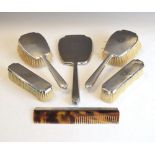 George V six piece dressing table set with engine turned decoration comprising: brushes, comb and
