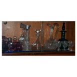 Quantity of cranberry glass together with a selection of clear cut glass decanters etc Condition: