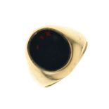 Yellow metal and bloodstone signet ring with oval matrix, shank stamped 9, size R½, 6.8g gross