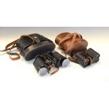 Two pairs of cased binoculars Condition: Both cases showing signs of general wear, small brown