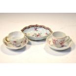 Two Chinese Export porcelain cups and saucers decorated in puce camaieu, together with a European