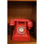 Red plastic Ericson N1002 telephone Condition: Not sold as a working item, cable has no connector,
