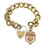 9ct gold curb link bracelet with heart shaped padlock and fob, the whole of unusually heavy gauge,