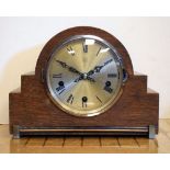 1920's oak cased mantel clock Condition: Losses to veneer particularly noticeable on right hand side