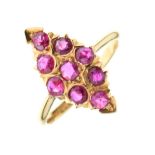 Yellow metal and ruby dress ring set nine stones in lozenge formation, shank stamped 22ct, size