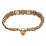 Yellow metal gate link bracelet with 9ct gold padlock, 17.5g approx Condition: **Due to current