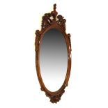 Reproduction mahogany framed Chippendale-style oval bevelled wall mirror, 48cm wide x 96.5cm high (