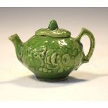 Chinese miniature tea pot and cover, moulded foliate decoration covered in a green glaze, 6.5cm high