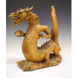 Chinese carved softwood sculpture of a dragon, 52cm high Condition: Losses to end of tail (the