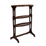 Mahogany octagonal three-tier etagere, 73cm high x 49cm wide Condition: Signs of discolouration in