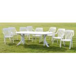 White plastic patio set to include; extending table with eight chairs, cushions, etc Condition: