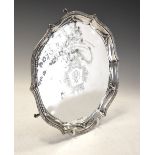 Edward VII silver salver with classical shaped border and standing on three scroll feet, the top