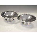 Pair of George V silver pedestal bowls, Sheffield 1933, 13cm diameter, 165g approx Condition:
