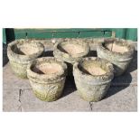 Set of five stone effect garden planters with floral decoration by the Hacienda Studio