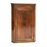 George III oak hanging corner cupboard enclosing three shaped shelves, 122cm high Condition: One