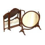 Early 20th Century mahogany oval swing dressing mirror, 69cm wide, together with a triptych dressing