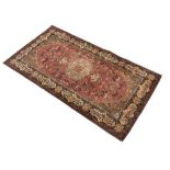 Middle Eastern-style machine-made wall hanging in the manner of a 'Hunting Carpet', the madder