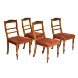 Manner of James Shoolbred, set of four late 19th century upholstered walnut dining chairs,