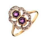 Unusual 9ct gold dress ring set two hexagonal-cut amethyst-coloured stones within a border of