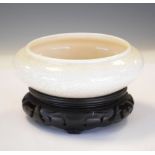 Porcelain censer with cream crackle glaze, probably Japanese, on hardwood stand, 15cm diameter