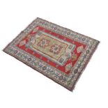 Anatolian (Turkey) wool rug, 167cm x 226cm Condition: Significant wear to pile including some holes,