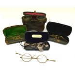 Cased pair of field glasses or opera glasses, with hide-covered barrel, together with a cased pair