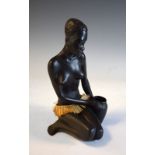Austrian mid century ceramic figure of an African woman, applied label to base, 25cm high Condition: