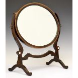 Early 20th Century inlaid mahogany oval swing dressing mirror, 51cm wide Condition: Has been