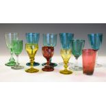 Collection of 19th Century coloured glass wines and liqueur glasses, together with a cranberry glass