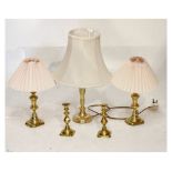 Three brass table lamps, together with two brass candlesticks Condition: Lamps not tested, and not