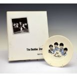 The Beatles Unseen, by Mark Haywood, together with a small Beatles collectors plate, 18cm diameter