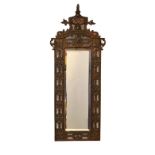 Cast copper pier mirror in Renaissance revival style, 47cm x 19cm overall Condition: Foxing/marks to