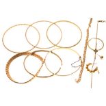 Selection of unmarked, rolled gold and base metal bangles and other jewellery Condition: No