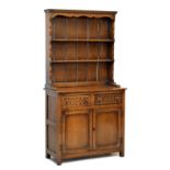 Old reproduction dresser, 172cm x 91cm x 40cm, together with a nest of tables Condition: Drawers