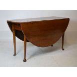 19th Century oak oval drop-leaf padfoot dining table with fitted drawers, 137cm wide Condition: Some