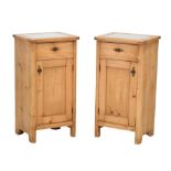 Pair of French pine bedside cabinets, having inset glass tops, 81cm high x 42cm wide Condition: