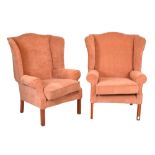 Pair of Georgian-style wingback armchairs, upholstered in salmon pink fabric Condition: Arm caps are