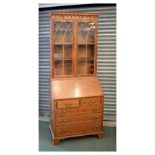 Reproduction yew veneered bureau bookcase, 206cm high Condition: Glass would benefit from a clean,