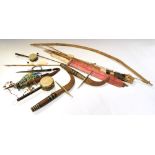 Quantity of tribal and other tourist pieces to include; bow and arrows (a/f), Kenyan knife in red