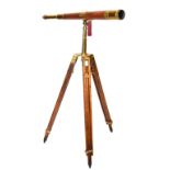 19th Century brass mounted telescope on tripod base, 115cm high Condition: Numerous dents, nicks,