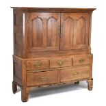 Oak country style cupboard on a drawer base, 144cm high x 132cm wide Condition: Some signs of