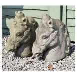 Pair of modern composition stone effect garden ornaments in the form of horse's heads, 40cm high
