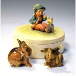 Hummel lidded box, and two Continental porcelain rabbits, 13cm high and smaller Condition: Hummel