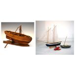 Quantity of wooden model sailing boats/vessels Condition: The large ship having some staining to the