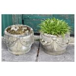 Pair of modern composition stone effect circular garden planters with swag decoration, 32cm high